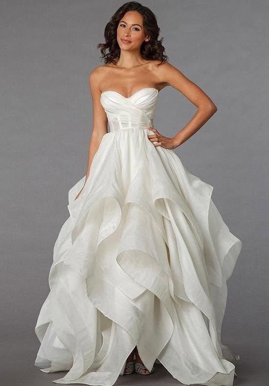 Strapless white bridal gown with flowing layered skirt